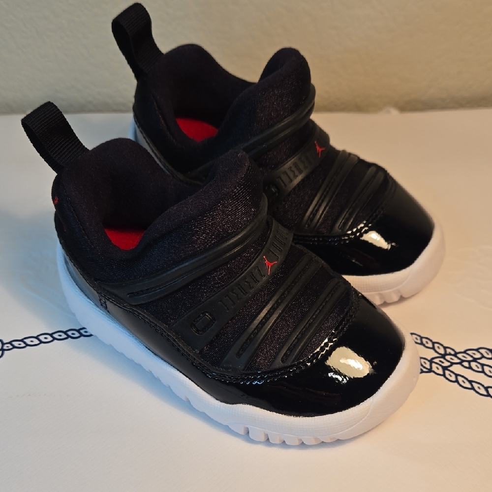 Jordan Kids Black and White Sneakers with Red Accents
